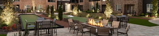 A modern apartment complex with a fire pit in the courtyard at Liam at Hays Farm in Huntsville, Alabama