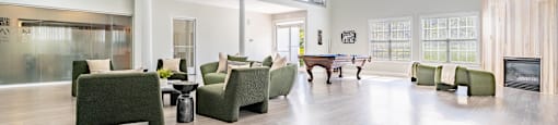 a large living room with furniture and a pool table