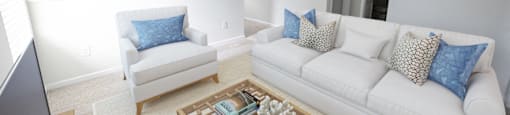 a living room with two couches and a coffee table