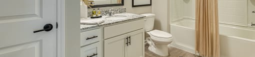 stunning bathroom with granite countertops
