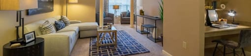a living room with a couch and a table