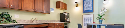 a kitchen and dining room with a table and chairs