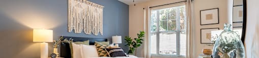 a bedroom with a large bed and a ceiling fan