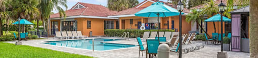 Sparkling swimming pool and spacious sundeck at Midora at Woodmont in Tamarac, FL