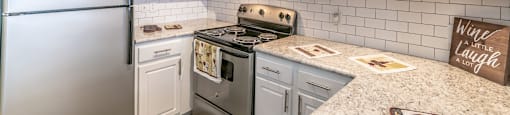 Kitchen at Mission Club Apartments in Orlando, FL