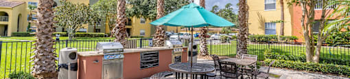 Outdoor Grilling Station at Mission Club Apartments in Orlando, FL