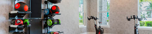 A room with exercise equipment and a window.