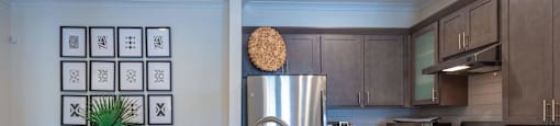 a kitchen with stainless steel appliances and granite counter tops