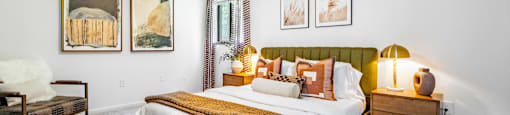 a bedroom with a bed and a ceiling fan