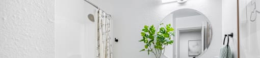 a bathroom with a sink toilet and a shower