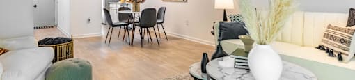 a living room and dining room with a couch and a table