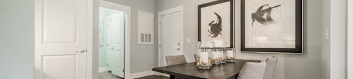 an open living room and dining room with a table and chairs
