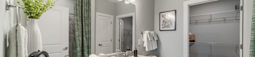 a bathroom with a sink and a toilet and a shower