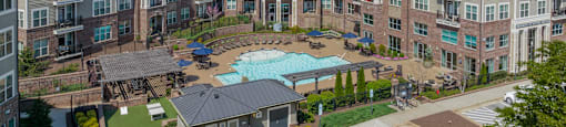 an aerial view of a large apartment complex with a pool