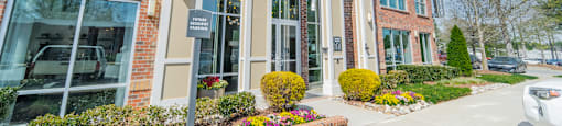 a picture of the front of the building with a car parked in front of it