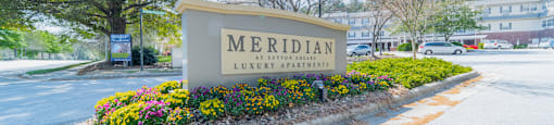 a sign that says meridian in front of a building