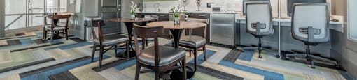 the reserve at bucklin hill clubhouse resident lounge with tables and chairs