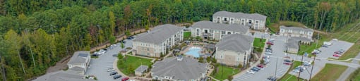 an aerial view of a community with houses and parking lot