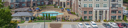 a large parking lot with a large building in the background