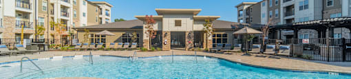 the preserve at ballantyne commons pool with apartment buildings