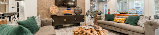 a living room with couches and a coffee table