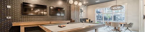 a billiards table in a clubhouse with a ping pong