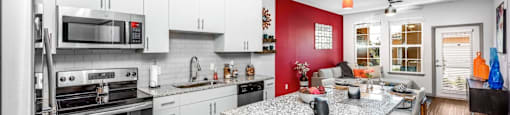 the kitchen and living room of a house with a counter top and