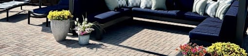 a patio with couches and a canopy
