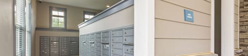 a locker room with blue lockers and a stone wall