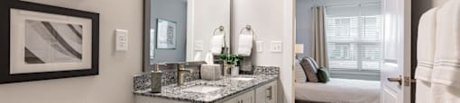 a bathroom with a mirror and a toilet and a sink