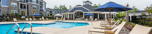 our apartments offer a swimming pool with lounge chairs and umbrellas