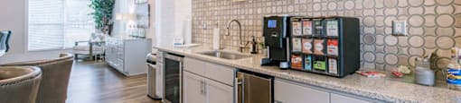 a kitchen with a counter and a coffee machine