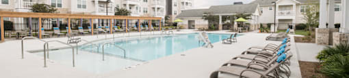 the preserve at ballantyne commons pool with lounge chairs and apartment buildings
