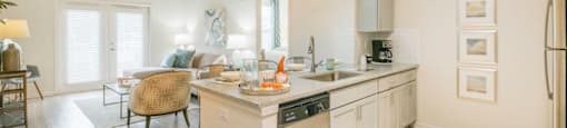 a kitchen and living room with an open floor plan