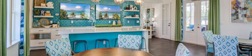 a dining room with blue chairs and a table