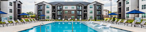 the swimming pool at the estates apartments