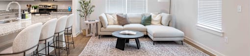 a living room with a couch and a table
