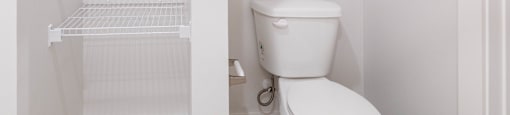a small bathroom with a toilet and a closet