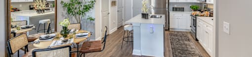 A modern kitchen with a dining table and chairs.