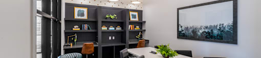 Private coworking spaces with computers and conference table