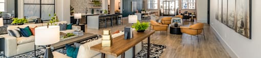 a living room with couches and chairs and a table