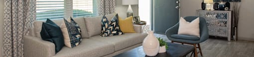 a living room with a couch and a coffee table