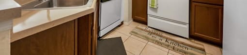 a kitchen with a stove and a sink
