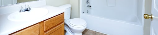 a bathroom with a sink toilet and a tub