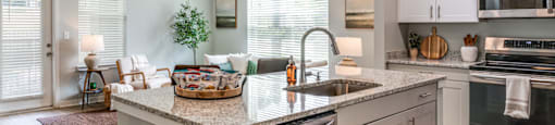 a large kitchen with a large island in the middle