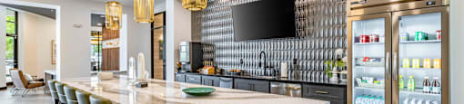a large kitchen with a marble counter top