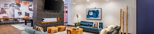 a living room with couches and chairs and a fireplace