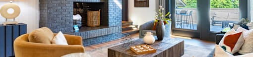 a living room with a fireplace and a television