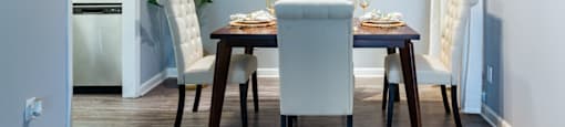 a dining room with a table and chairs
