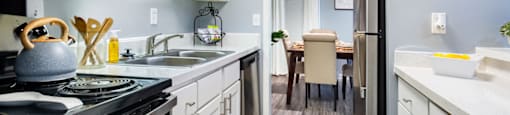 a kitchen with white cabinets and stainless steel appliances and a black stove